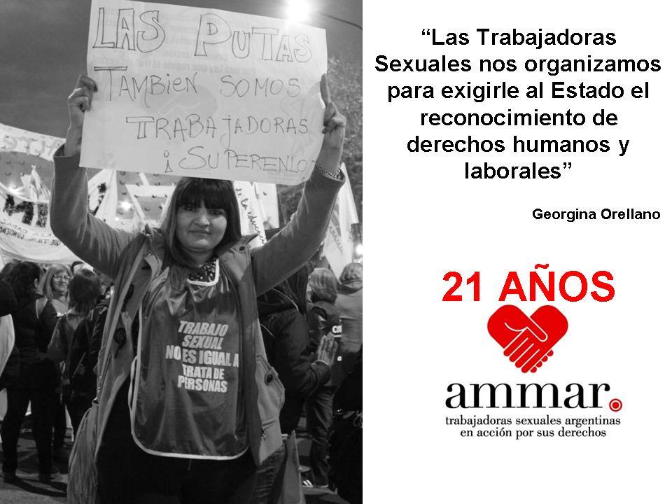 Sex worker activist Georgina Orellano from AMMAR holds up a placard at an AMMAR demonstration. The right side of the image celebrates 21 years of AMMAR organising, with the organisation logo in red.